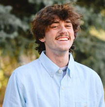 Aiden Langston speaking at a Utah business event, inspiring local entrepreneurs and youth.